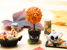 Load image into Gallery viewer, Pumpkin Topiary in Painted Skull Pot – Halloween Miniature Decor – OOAK 1:12 Scale