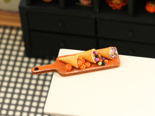 Load image into Gallery viewer, Halloween Cornucopia and Cream Horn on Orange Board - Handmade Miniature Food for 12th Scale Dollhouse