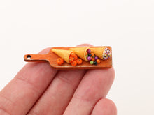 Load image into Gallery viewer, Halloween Cornucopia and Cream Horn on Orange Board - Handmade Miniature Food for 12th Scale Dollhouse