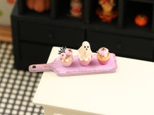 Load image into Gallery viewer, Three Pink Halloween Cupcakes (Glowing Ghost) on Pink Board - Handmade Miniature Food for 12th Scale Dollhous