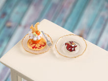 Load image into Gallery viewer, Delicate miniature dessert with a small figurine of a squirrel on a decorative plate against a blurred background
