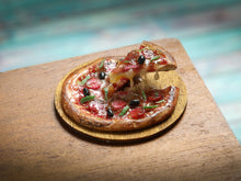 Load image into Gallery viewer, Miniature Pizza with Slice in a 'Frozen Moment' - Handmade Dollhouse Food in 12th Scale