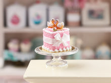 Load image into Gallery viewer, Handmade Miniature Dollhouse Cake with Elegant Pastry Swans – Pink Wedding &amp; Celebration Decor
