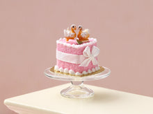 Load image into Gallery viewer, Handmade Miniature Dollhouse Cake with Elegant Pastry Swans – Pink Wedding &amp; Celebration Decor