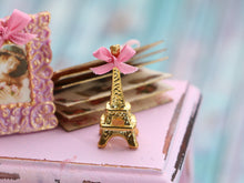 Load image into Gallery viewer, Decorative Golden Eiffel Tower (Tour Eiffel) Ornament with Pink Bow - 12th Scale Dollhouse Miniature