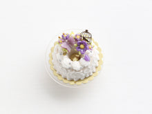 Load image into Gallery viewer, Savarin with purple floral decoration Miniature Food Dessert with swirls and golden birdcage - OOAK