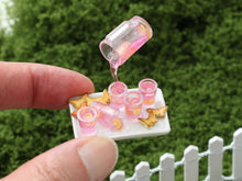 Load image into Gallery viewer, Pouring Pink Lemonade on Tray with Spring Cookies - Frozen Moment - Handmade Miniature Dollhouse Food