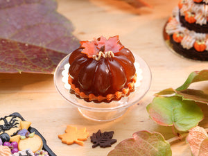 Pumpkin-Shaped Caramel Dessert Decorated with Autumn Leaves