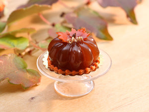 Pumpkin-Shaped Caramel Dessert Decorated with Autumn Leaves