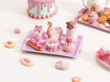 Load image into Gallery viewer, Beautiful presentation of pink miniature French pastries and treats (swan, éclair, religieuse)