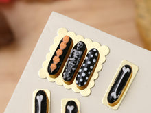 Load image into Gallery viewer, Presentation of Halloween French Eclairs - Skeleton! - 12th Scale Handmade Miniature Pastries