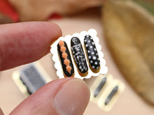 Load image into Gallery viewer, Presentation of Halloween French Eclairs - Skeleton! - 12th Scale Handmade Miniature Pastries