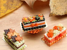 Load image into Gallery viewer, Rectangular Miniature Autumn Cake, Marguerites, Pumpkins, Black Icing, Orange Bow - 12th Scale Dollhouse Food