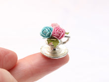 Load image into Gallery viewer, Floral Pink and Blue Rose Display in Silver Metal Teacup Planter - Dollhouse Miniature Decoration
