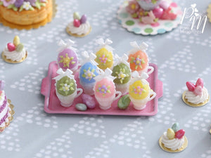 Handmade Miniature Presentation of Colourful Easter Eggs in Cups on Pink Metal Tray