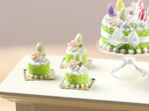 Spring Green Genoise Easter Individual Pastry Decorated with Candy Egg and Blossom
