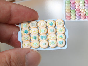 Presentation of Turquoise Decorated Cookies on Light Blue Baking Tray - Miniature Food