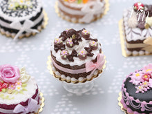 Load image into Gallery viewer, Cream Cake Decorated with Chocolate Palets, Bows, Blossoms and Macaron - Miniature Food