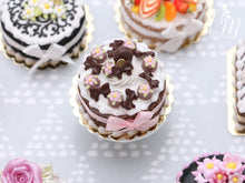 Load image into Gallery viewer, Cream Cake Decorated with Chocolate Palets, Bows, Blossoms and Macaron - Miniature Food