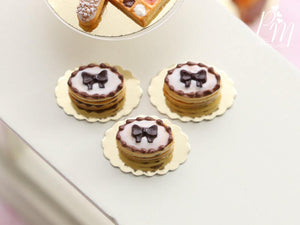 Shortbread Sablé (French Biscuit) Filled with Chocolate Cream, Decorated with Chocolate Bow