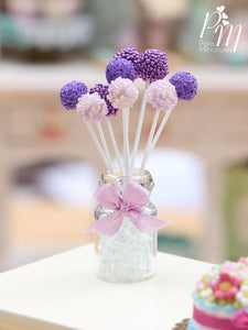 Purple and Pink Cake Pops Presented in a Glass Display Jar