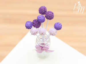 Purple and Pink Cake Pops Presented in a Glass Display Jar