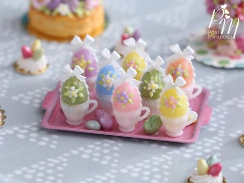 Handmade Miniature Presentation of Colourful Easter Eggs in Cups on Pink Metal Tray