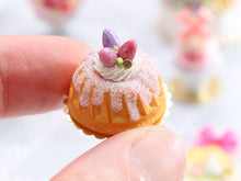 Load image into Gallery viewer, Easter Kouglof decorated with pink egg meringue nest and sparkly frosting