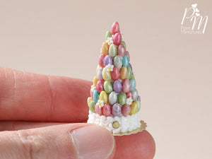 Easter Pièce Montée "Tree" with Colourful Sugar Eggs shown with thumb for scale
